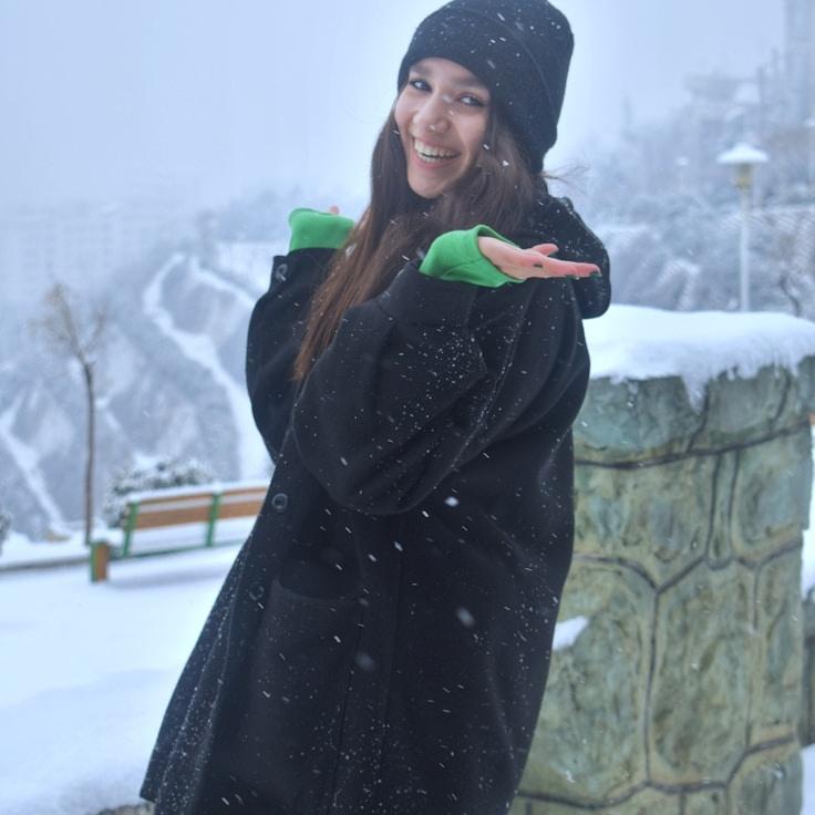 Avery Lin, Lead Design Curator at Crystal Valley Path, reviewing corporate floral arrangements